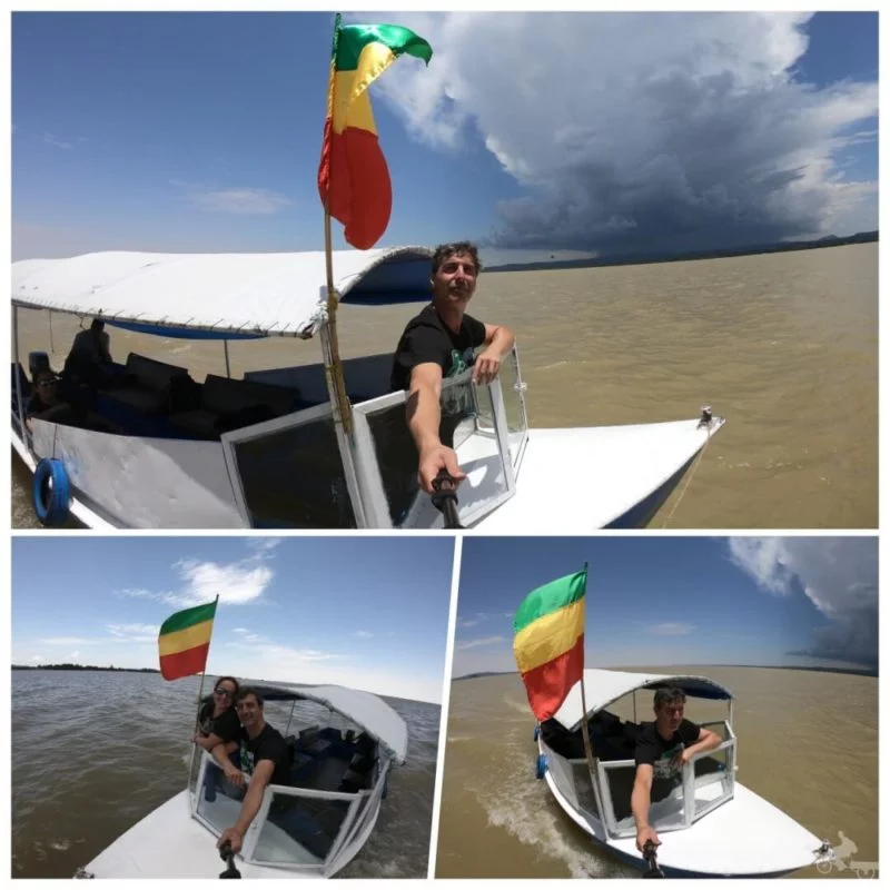 barca navegando lago tana